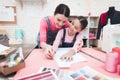 Mom and daughter make new layouts for dresses.