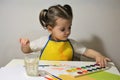 The little girl draws enthusiastically. Royalty Free Stock Photo