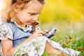 Little girl draws on PDA Royalty Free Stock Photo