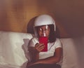 Little girl dreams of becoming an astronaut and flying into space Royalty Free Stock Photo