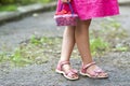 Little girl in dress child hand holdind small basket of ripe raspberries. Close-up Royalty Free Stock Photo