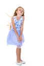 Little girl in a dress developing in the wind. Royalty Free Stock Photo