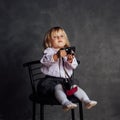 Little girl in dress and hat photographs