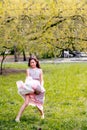 Little girl in a dress is jumping outdoors. Royalty Free Stock Photo