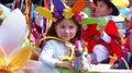 Little girl dressed in carnival costume with can of spray