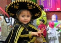 Little girl dressed up for Christmas parade. Ecuador