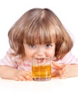 Little girl drinking apple juice