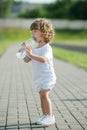 Little girl drinking clean water from plastic Royalty Free Stock Photo