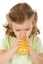 Little girl drinking fruit juice Royalty Free Stock Photo