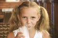 Little girl is drinking milk Royalty Free Stock Photo