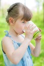 Little Girl Drinking Milk Outdoor. Village - Countryside. Health Royalty Free Stock Photo