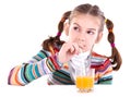 Little girl drinking orange juice