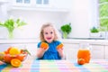 Little girl drinking orange juice Royalty Free Stock Photo