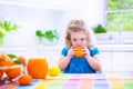 Little girl drinking orange juice Royalty Free Stock Photo