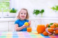 Little girl drinking orange juice Royalty Free Stock Photo