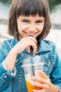 Little girl drinking a smoothie