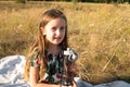 Little girl drinking water from a glass bottle in nature Royalty Free Stock Photo