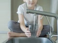 Little girl drinking from water tap or faucet in kitchen. Pouring fresh drink. Healthy lifestyle. Water quality check concept. Royalty Free Stock Photo