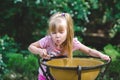 Little girl drinks water from a drinking fountain Royalty Free Stock Photo