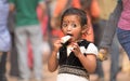 Little girl eagerly eating an ice cream. Royalty Free Stock Photo