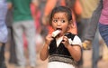 Little girl eagerly eating an ice cream. Royalty Free Stock Photo