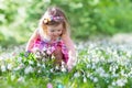 Little girl on Easter egg hunt Royalty Free Stock Photo