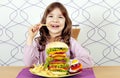 Little girl eat big hamburger and french fries Royalty Free Stock Photo