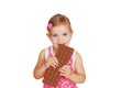 Little girl eat large chocolate