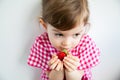 Little girl eating a big strawberry Royalty Free Stock Photo