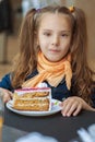 Little girl eating cake