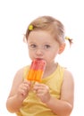 Little girl eating colorful ice lolly