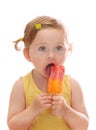 Little girl eating colorful icelolly Royalty Free Stock Photo