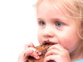 A little girl eating a cookie Royalty Free Stock Photo