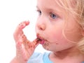 A little girl eating a cookie Royalty Free Stock Photo