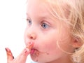 A little girl eating a cookie Royalty Free Stock Photo