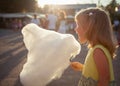 Little girl eating cotton candy Royalty Free Stock Photo