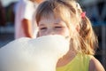 Little girl eating cotton candy Royalty Free Stock Photo