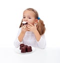Little girl eating creamy chocolate dessert Royalty Free Stock Photo