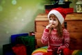 Little girl eating Cristmas cookies