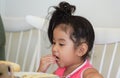 Little girl is eating delicious food Royalty Free Stock Photo