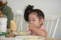 Little girl is eating delicious food Royalty Free Stock Photo