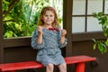 Little girl eating delicious strawberries on skewers, savoring the simple pleasures of family and healthy food. Happy Royalty Free Stock Photo