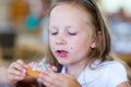 Little girl eating donut Royalty Free Stock Photo