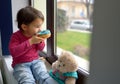 Little girl eating donuts