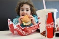 Little girl eating fast food