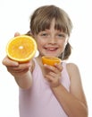 Little girl eating fresh orange Royalty Free Stock Photo