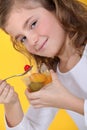 Little girl eating fruit Royalty Free Stock Photo