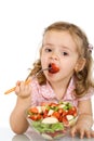 Little girl eating fruit salad Royalty Free Stock Photo