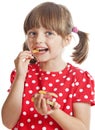 Little girl eating gelatine candy Royalty Free Stock Photo