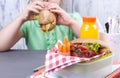 A little girl is eating her lunch at school. Lunch schoolgirl. Toast and and fresh juice and salad for a healthy dinner. Free Royalty Free Stock Photo